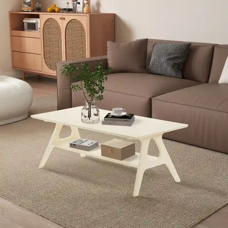 Living room with a brown sofa, white coffee table, and wooden cabinet.